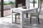 Pack de 1 mesa de sala extensível em branco brilho + 4 cadeiras Sakura bege Pack de 1 mesa de sala extensível em branco brilho + 4 cadeiras Sakura bege